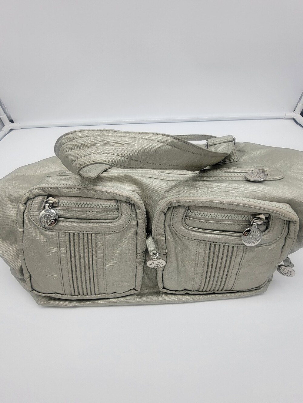 Kipling Metallic Silver Shoulder Bag with Dual Front Pockets